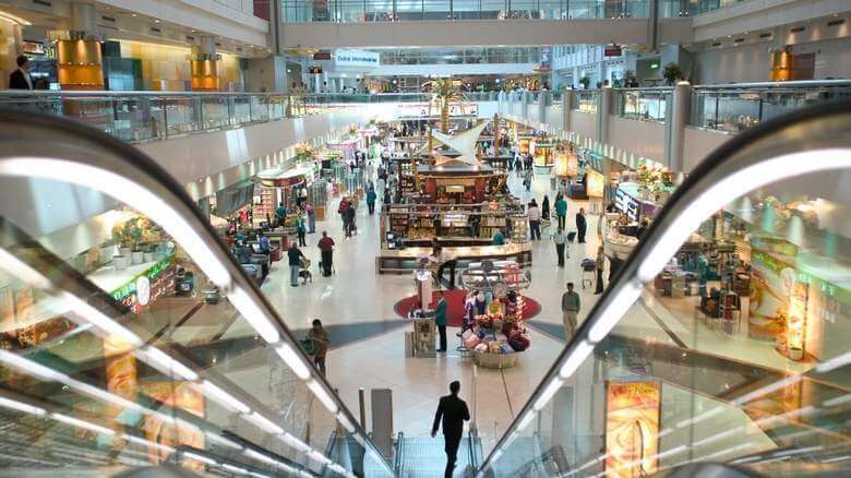 View of the duty free area from the top of an escalator